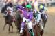 LOUISVILLE, KY - MAY 03: Jockey Victor Espinoza celebrates atop of California Chrome #5 after crossing the finish line to win the 140th running of the Kentucky Derby at Churchill Downs on May 3, 2014 in Louisville, Kentucky. (Photo by Matthew Stockman/Getty Images)