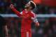 SOUTHAMPTON, ENGLAND - DECEMBER 22: Adam Lallana of Southampton celebrates after scoring the opening goal during the Barclays Premier League match between Southampton and Tottenham Hotspur at St Mary's Stadium on December 22, 2013 in Southampton, England. (Photo by Paul Gilham/Getty Images)