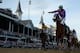 LOUISVILLE, KY - MAY 03: Jockey Victor Espinoza celebrates atop of California Chrome #5 after crossing the finish line to win the 140th running of the Kentucky Derby at Churchill Downs on May 3, 2014 in Louisville, Kentucky. (Photo by Rob Carr/Getty Images)