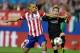 Barcelona's Jordi Alba, right, fights for the ball with Atletico's Miranda during the Champions League quarterfinal second leg soccer match between Atletico Madrid and FC Barcelona in the Vicente Calderon stadium in Madrid, Spain, Wednesday, April 9, 2014. (AP Photo/Paul White)