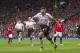 Liverpool's Steven Gerrard celebrates after scoring against Manchester United during their English Premier League soccer match at Old Trafford Stadium, Manchester, England, Sunday March 16, 2014. (AP Photo/Jon Super)