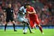 LIVERPOOL, ENGLAND - MAY 11: Luis Suarez of Liverpool takes on Moussa Sissoko of Newcastle United during the Barclays Premier League match between Liverpool and Newcastle United at Anfield on May 11, 2014 in Liverpool, England. (Photo by Laurence Griffiths/Getty Images)