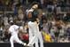 Miami Marlins starting pitcher Jose Fernandez stares into the outfield as San Diego Padres' Jedd Gyorko rounds the bases with a grand slam home run during the sixth inning of a baseball game Friday, May 9, 2014, in San Diego. (AP Photo/Lenny Ignelzi)