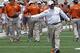 Texas coach Charlie Strong calls out to his players during the first half of the team's Orange and White spring NCAA college football game, Saturday, April 19, 2014, in Austin, Texas. (AP Photo/Michael Thomas)