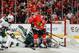 CHICAGO, IL - MAY 11: Jonathan Toews #19 of the Chicago Blackhawks scores on goalie Ilya Bryzgalov #30 of the Minnesota Wild in the third period, as Ryan Suter #20 of the Wild skates behind, in Game Five of the Second Round of the 2014 Stanley Cup Playoffs at the United Center on May 11, 2014 in Chicago, Illinois. (Photo by Bill Smith/NHLI via Getty Images)