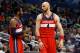 Mar 14, 2014; Orlando, FL, USA; Washington Wizards guard John Wall (2) and center Marcin Gortat (4) talk against the Orlando Magic during the second half at Amway Center. Washington Wizards defeated the Orlando Magic 105-101. Mandatory Credit: Kim Klement-USA TODAY Sports
