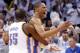 Oklahoma City Thunder forward Kevin Durant (35) celebrates with teammate Russell Westbrook, right, at the end of Game 5 of the Western Conference semifinal NBA basketball playoff series against the Los Angeles Clippers in Oklahoma City, Tuesday, May 13, 2014. Oklahoma City won 105-104. (AP Photo)