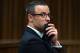 Oscar Pistorius, gestures, as he listens to psychiatric evidence for his defense, during his ongoing murder trial in Pretoria, South Africa, Tuesday, May 13, 2014. The chief prosecutor in the murder trial of Oscar Pistorius has asked that the double-amputee runner be placed under psychiatric evaluation after an expert witness testified that he had an anxiety disorder. Pistorius is charged with the shooting death of his girlfriend Reeva Steenkamp on Valentine's Day in 2013. (AP Photo/Daniel Born, Pool)