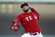 Texas Rangers starting pitcher Martin Perez (33) throws to the Boston Red Sox during the first inning of a baseball game, Saturday, May 10, 2014, in Arlington, Texas. (AP Photo/Jim Cowsert)