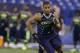 Washington running back Bishop Sankey runs a drill at the NFL football scouting combine in Indianapolis, Sunday, Feb. 23, 2014. (AP Photo/Michael Conroy)