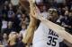 FILE - In this March 7, 2014 file photo, Yale's Brandon Sherrod, right, fouls Harvard's Siyani Chambers, left, during the second half of an NCAA college basketball game in New Haven, Conn. Sherrod is taking off from the team's 2014-15 season to tour with the Whiffenpoofs, the school's a cappella singing group. (AP Photo/Jessica Hill, File)
