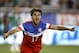 U.S. forward Chris Wondolowski (17) celebrates after scoring a first-half goal against Mexico during an international friendly soccer match Wednesday, April 2, 2014, in Glendale, Ariz. (AP Photo/Rock Scuteri)