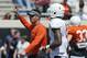 Oklahoma State head coach Mike Gundy directs an Orange Blitz NCAA college spring football practice in Stillwater, Okla., Saturday, April 5, 2014. (AP Photo/Sue Ogrocki)