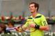 MADRID, SPAIN - MAY 08: Andy Murray of Great Britain shows his frustrations against Santiago Giraldo of Columbia in their third round match during day six of the Mutua Madrid Open tennis tournament at the Caja Magica on May 8, 2014 in Madrid, Spain. (Photo by Clive Brunskill/Getty Images)