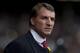 Liverpool's manager Brendan Rodgers takes to the touchline before his team's English Premier League soccer match against Tottenham at Anfield Stadium, Liverpool, England, Sunday March 30, 2014. (AP Photo/Jon Super)