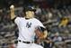 New York Yankees starting pitcher Masahiro Tanaka throws in the first inning of their baseball game against the Los Angeles Angels at Yankee Stadium, Sunday, April 27, 2014, in New York. The Yankees won 3-2. (AP Photo/John Minchillo)