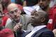 NBA Commissioner Adam Silver, left, shakes hands with Magic Johnson as they watch the Los Angeles Clippers play the Oklahoma City Thunder in the first half of Game 4 of the Western Conference semifinal NBA basketball playoff series, Sunday, May 11, 2014, in Los Angeles. (AP Photo/Mark J. Terrill)