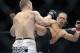 Urijah Faber, right, battles Michael McDonald in a UFC Mixed Martial Arts bantamweight fight in Sacramento, Calif., on Saturday, Dec. 14, 2013.(AP Photo/Steve Yeater)