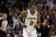May 4, 2014; San Antonio, TX, USA; San Antonio Spurs forward Kawhi Leonard (2) reacts after a shot against the Dallas Mavericks in game seven of the first round of the 2014 NBA Playoffs at AT&T Center. The Spurs won 119-96. Mandatory Credit: Soobum Im-USA TODAY Sports