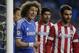 Chelsea's David Luiz, left, gestures to his teammates as he waits by the oat for a corner kick to be taken during the Champions League semifinal second leg soccer match between Chelsea and Atletico Madrid at Stamford Bridge stadium in London, Wednesday, April 30, 2014. (AP Photo/Matt Dunham)