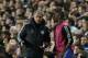 Chelsea's manager Jose Mourinho, left talks to substitute Chelsea's Samuel Eto'o as he wait to come on during the Champions League semifinal second leg soccer match between Chelsea and Atletico Madrid at Stamford Bridge stadium in London, Wednesday, April 30, 2014. (AP Photo/Matt Dunham)
