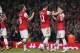 Arsenal's Mesut Ozil, right celebrates after scoring his sides second goal during their English Premier League soccer match between Arsenal and Newcastle United at the Emirates stadium in London, Monday, April 28, 2014. (AP Photo/Alastair Grant)