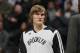 Brooklyn Nets forward Andrei Kirilenko, of Russia, looks on againsst the Denver Nuggets in the third quarter of the Nets' 112-89 victory in an NBA basketball game in Denver on Thursday, Feb. 27, 2014. (AP Photo/David Zalubowski)