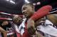 Washington Wizards guards John Wall, left, and Bradley Beal celebrate after an NBA basketball game against the Boston Celtics on Wednesday, April 2, 2014, in Washington. The Wizards won 118-92, and clinched a playoff berth. (AP Photo/Alex Brandon)