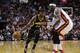 Indiana Pacers' Paul George (24) drives to the basket as Miami Heat's LeBron James defends during the first half of an NBA basketball game, Friday, April 11, 2014, in Miami. (AP Photo/Lynne Sladky)
