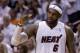 Miami Heat forward LeBron James (6) gives a thumbs-up to his teammates during the final minutes of the second half of Game 5 of a second-round NBA playoff basketball game against the Brooklyn Nets in Miami, Wednesday, May 14, 2014. The Heat won 96-94. (AP Photo)