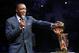 Former Detroit Pistons player Isiah Thomas addresses the audience during a half-time celebration of the 1989 NBA championship during an NBA basketball game against the Miami Heat, Friday, March 28, 2014, in Auburn Hills, Mich. (AP Photo/Duane Burleson)