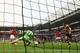 HULL, ENGLAND - APRIL 20: Lukas Podolski (L) of Arsenal shoots past Steve Harper the Hull City goalkeeper and James Chester (R) of Hull City to score his sides third goal during the Barclays Premier League match between Hull City and Arsenal at KC Stadium on April 20, 2014 in Hull, England. (Photo by Matthew Lewis/Getty Images)