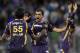 Kolkata Knight Riders' Gautam Gambhir, right, and L. Balaji celebrates after their team won the match against Mumbai Indians during the Indian Premier League (IPL) cricket match in Mumbai, India, Wednesday, May 16, 2012. (AP Photo/ Rajanish Kakade)