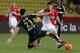 Monaco's James Rodriguez, right, challenges for the ball with Reims' player Aissa Mandi their French League One soccer match, in Monaco stadium, Friday, Feb. 21 , 2014. (AP Photo/Lionel Cironneau)