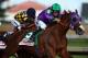 LOUISVILLE, KY - MAY 03: California Chrome #5, ridden by Victor Espinoza, comes out of the fourth turn enroute to winning the 140th running of the Kentucky Derby at Churchill Downs on May 3, 2014 in Louisville, Kentucky. (Photo by Andy Lyons/Getty Images)