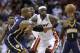Miami Heat's LeBron James, middle, and Indiana Pacers' David West (21) watch the ball get away during the first half of an NBA basketball game, Friday, April 11, 2014, in Miami. (AP Photo/Lynne Sladky)