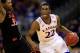KANSAS CITY, MO - MARCH 13: Andrew Wiggins #22 of the Kansas Jayhawks drives upcourt as Marcus Smart #33 of the Oklahoma State Cowboys defends during the Big 12 Basketball Tournament quarterfinal game at Sprint Center on March 13, 2014 in Kansas City, Missouri. (Photo by Jamie Squire/Getty Images)