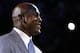 Charlotte Bobcats owner Michael Jordan speaks to fans before unveiling the new Charlotte Hornets logo during a ceremony at an NBA basketball game between the Charlotte Bobcats and the Utah Jazz in Charlotte, N.C., Saturday, Dec. 21, 2013. The Bobcats will change their name to Hornets starting next season. (AP Photo/Chuck Burton)