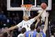 Adreian Payne (5) reaches for a loose ball against Delaware in the first half during the second round of the NCAA college basketball tournament in Spokane, Wash., Thursday, March 20, 2014. (AP Photo/Elaine Thompson)