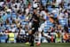 Real Madrid's Sami Khedira from Germany, right, duels for the ball with Espanyol's Hector Moreno from Mexico during a Spanish La Liga soccer match at the Santiago Bernabeu stadium in Madrid, Spain, Saturday, May 17, 2014. (AP Photo/Daniel Ochoa de Olza)