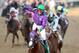 LOUISVILLE, KY - MAY 03: Jockey Victor Espinoza celebrates atop of California Chrome #5 after crossing the finish line to win the 140th running of the Kentucky Derby at Churchill Downs on May 3, 2014 in Louisville, Kentucky. (Photo by Matthew Stockman/Getty Images)