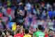 Players throw in the air Atletico's coach Diego Simeone from Argentina after a Spanish La Liga soccer match between FC Barcelona and Atletico Madrid at the Camp Nou stadium in Barcelona, Spain, Saturday, May 17, 2014. Atletico clinched its first league title in 18 years after a 1-1 draw. (AP Photo/Manu Fernandez)