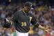 Pittsburgh Pirates starting pitcher Edinson Volquez (36) walks to the dugout after being pulled in the fifth inning of a baseball game against the St. Louis Cardinals in Pittsburgh Saturday, May 10, 2014. The Pirates won 4-3. (AP Photo/Gene J. Puskar)