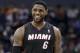 Miami Heat's LeBron James as he walks down the court during the second half in Game 4 of an opening-round NBA basketball playoff series against the Charlotte Bobcats in Charlotte, N.C., Monday, April 28, 2014. The Heat won 109-98, sweeping the series. (AP Photo/Chuck Burton)