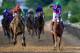 BALTIMORE, MD - MAY 17: California Chrome #3, ridden by Victor Espinoza, crosses the finishline to win the 139th running of the Preakness Stakes at Pimlico Race Course on May 17, 2014 in Baltimore, Maryland. (Photo by Rob Carr/Getty Images)