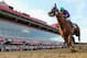 BALTIMORE, MD - MAY 17: California Chrome #3, ridden by Victor Espinoza, races to the finish line enroute to winning the 139th running of the Preakness Stakes at Pimlico Race Course on May 17, 2014 in Baltimore, Maryland. (Photo by Rob Carr/Getty Images)