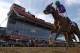California Chrome, ridden by jockey Victor Espinoza, wins the 139th Preakness Stakes horse race at Pimlico Race Course, Saturday, May 17, 2014, in Baltimore. (AP Photo/Matt Slocum)