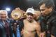 Juan Manuel Márquez, of Mexico, celebrates with championship belt after his victory over Mike Alvarado in the tenth round of a WBO welterweight title boxing match at the Forum in Inglewood, Calif., Saturday, May 17, 2014. (AP Photo/Ringo H.W. Chiu)