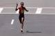 BOSTON, MA - APRIL 21: Rita Jeptoo of Kenya approaches the finish line to win the 118th Boston Marathon on April 21, 2014 in Boston, Massachusetts. (Photo by Jim Rogash/Getty Images)