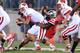 COLUMBUS, OH - SEPTEMBER 28: Curtis Grant #14 of the Ohio State Buckeyes sacks quarterback Joel Stave #2 of the Wisconsin Badgers in the third quarter at Ohio Stadium on September 28, 2013 in Columbus, Ohio. Ohio State defeated Wisconsin 31-24. (Photo by Jamie Sabau/Getty Images)